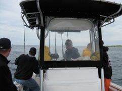 Captain Bobby Rice at Helm